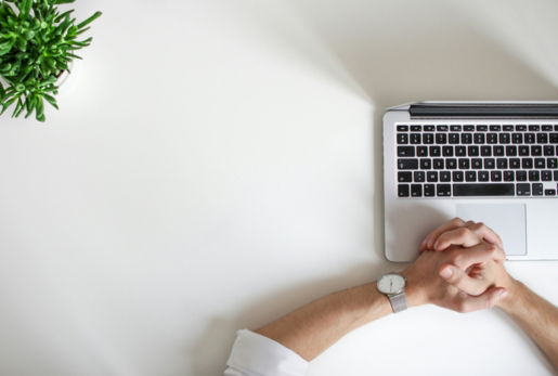person-wearing-watch-near-laptop.jpg person wearing watch near laptop